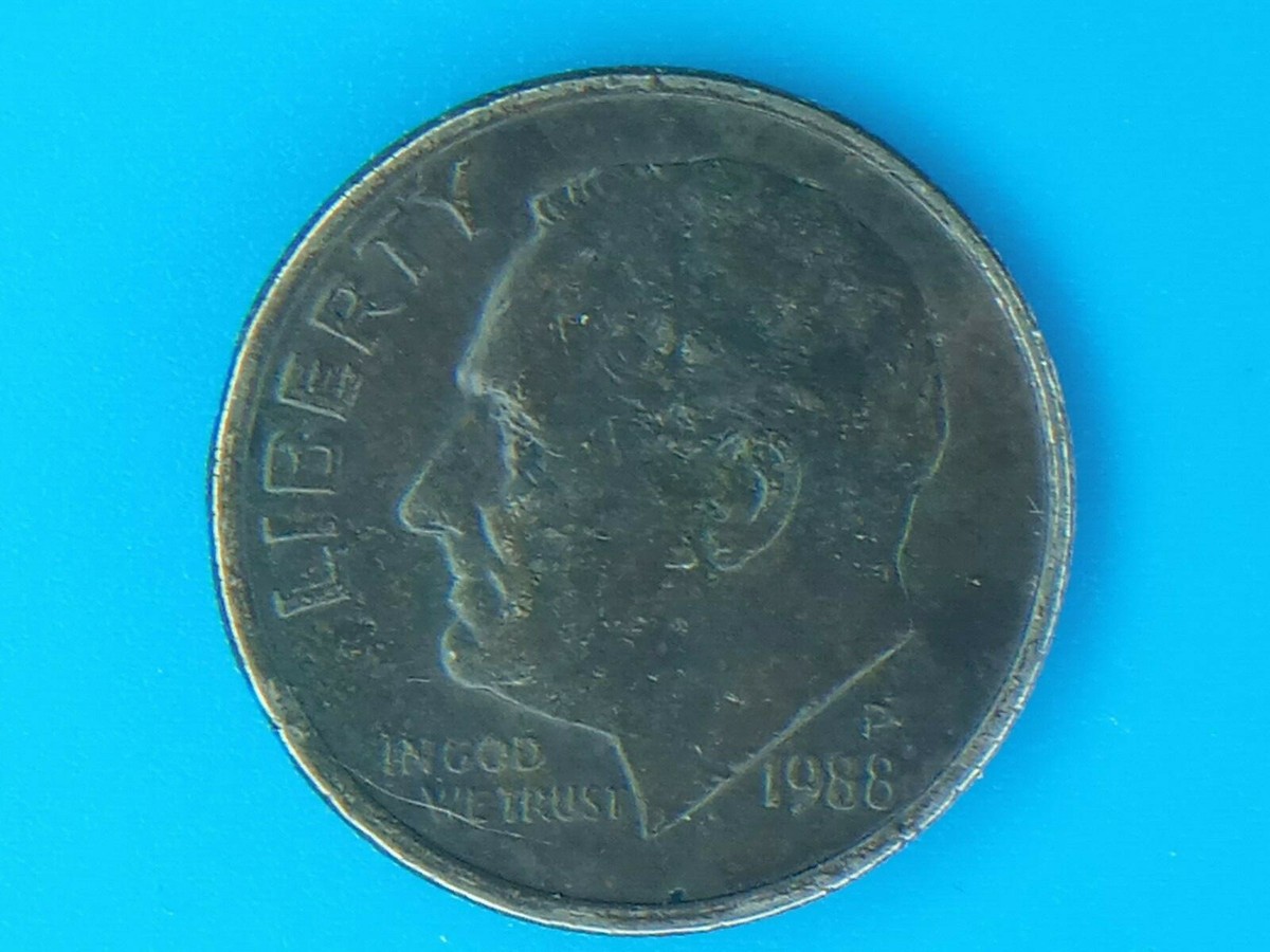 1988 dime missing clad layer error showing copper-colored interior surface on one side of the coin